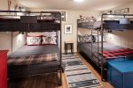 Check out this bunk room with FOUR FULL sized beds.